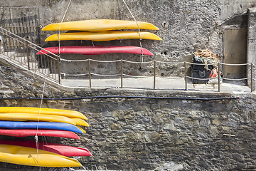 Image showing Plastic canoes, hanging on the wall