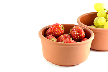 Image showing Grapes and strawberries in a bowl, isolated on white