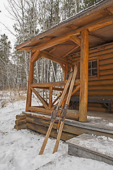 Image showing vintage skis and log cabin