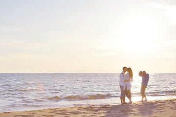 Image showing photographer taking photo on beach