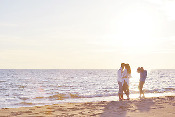 Image showing photographer taking photo on beach