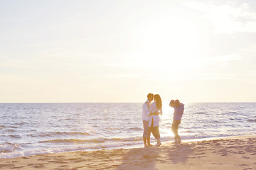 Image showing photographer taking photo on beach