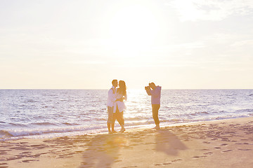 Image showing photographer taking photo on beach