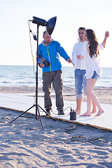 Image showing photographer taking photo on beach