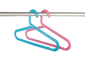 Image showing Pink and blue clothes hangers