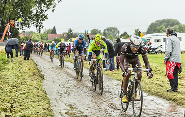 Image showing The Peloton on a Cobbled Road- Tour de France 2014