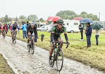 Image showing The Cyclist Yukiya Arashiro on a Cobbled Road - Tour de France 2