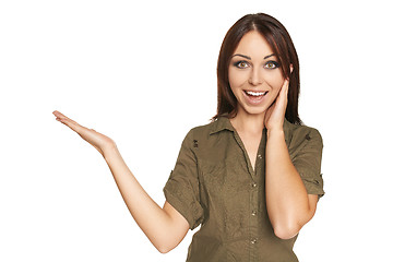 Image showing Surprised young woman showing open hand palm