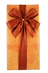 Image showing beautifully decorated gift box with bow on white