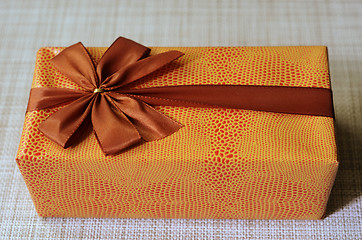 Image showing beautifully decorated gift box with bow