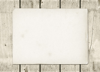 Image showing Blank vintage paper sheet on a white wood board