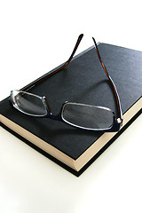 Image showing eyeglasses on book
