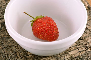 Image showing Fresh ripe strawberries on a vintage wooden background