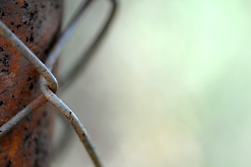 Image showing old metal wire mesh isolated on the black background