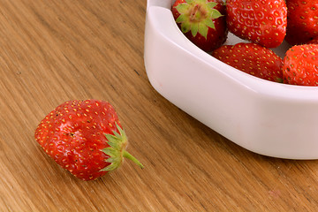 Image showing Fresh ripe strawberries on a vintage wooden background