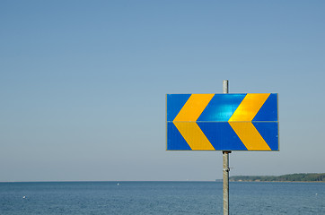 Image showing Arrows roadsign by the coast
