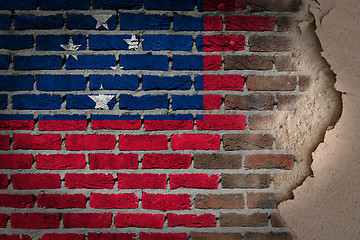 Image showing Dark brick wall with plaster - Samoa