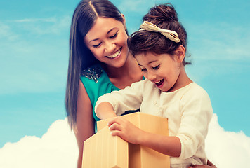 Image showing happy mother and child girl with gift box