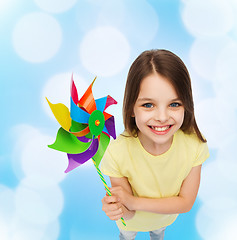 Image showing smiling child with colorful windmill toy