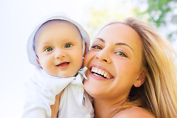 Image showing happy mother with little baby outdoors