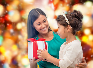 Image showing happy mother and child girl with gift box