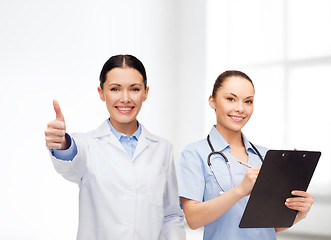 Image showing smiling female doctor and nurse