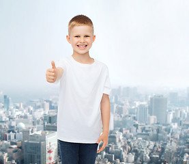 Image showing smiling boy in white t-shirt showing thumbs up