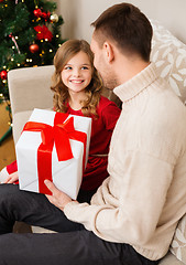 Image showing smiling father and daughter looking at each other