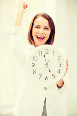 Image showing businesswoman with clock