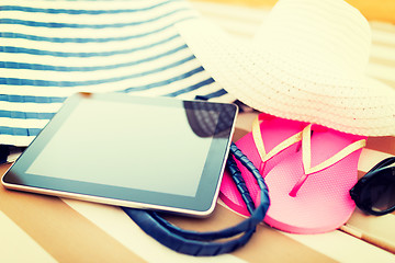 Image showing close up of tablet pc on beach