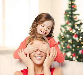 Image showing mother and daughter making a joke