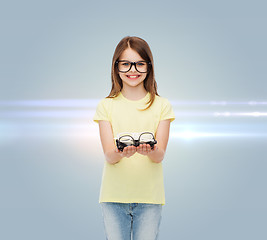 Image showing smiling cute little girl in black eyeglasses