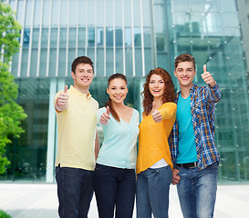 Image showing group of smiling teenagers over city background