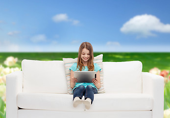 Image showing little girl sitting on sofa with tablet pc