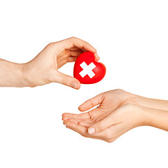 Image showing hand giving heart with red cross symbol