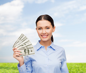 Image showing businesswoman with dollar cash money