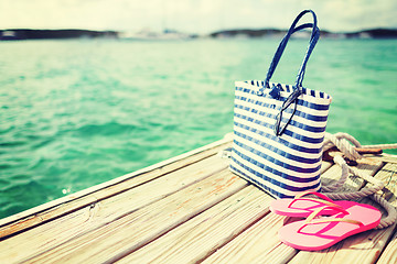 Image showing close up of beach accessories on wooden pier