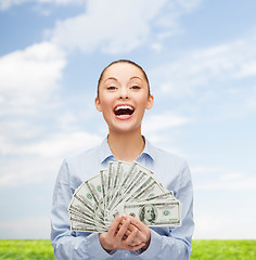 Image showing laughing businesswoman with dollar cash money