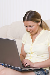 Image showing young pretty woman and laptop