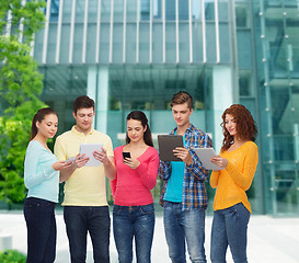 Image showing group of teenagers with smartphones and tablet pc