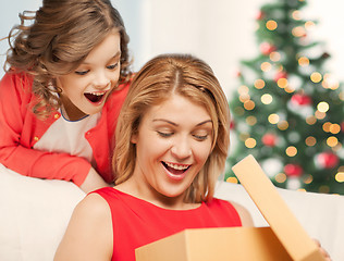 Image showing happy mother and child girl with gift box