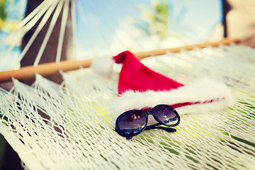 Image showing hammock with santa helper hat and shades