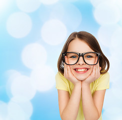 Image showing smiling cute little girl in black eyeglasses