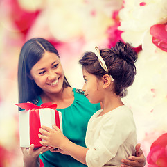 Image showing happy mother and child girl with gift box