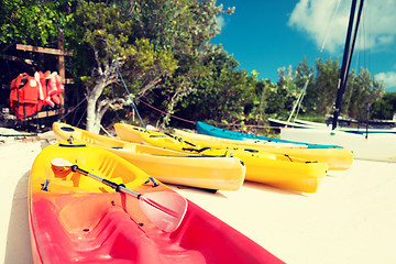 Image showing canoes on sandy beach