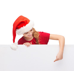 Image showing child in santa helper hat with blank white board