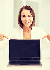 Image showing smiling woman with laptop pc