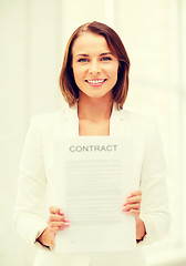 Image showing businesswoman holding contract