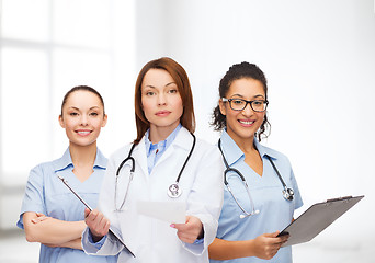 Image showing calm female doctor with clipboard