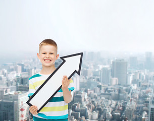 Image showing smiling little boy with blank arrow pointing right